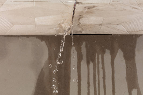 Professional Flood Damage Cleanup technician working in Uxbridge, MA